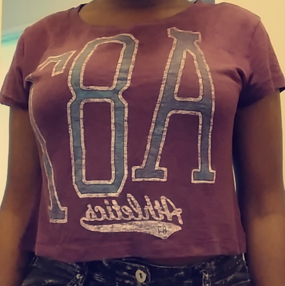 black jeans purple shirt